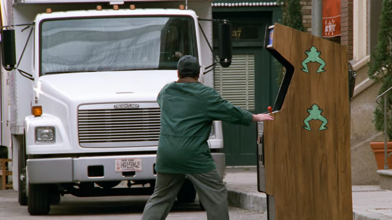George Costanza stands in front of a moving truck in Sinfield