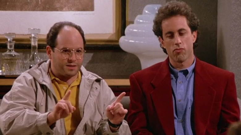 George Costanza (Jason Alexander) runs Jerry (Seinfeld) through a scenario during Seinfeld.