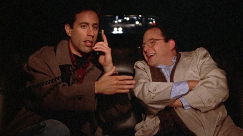Jerry and George, having a great time in the back of a limo on Seinfeld