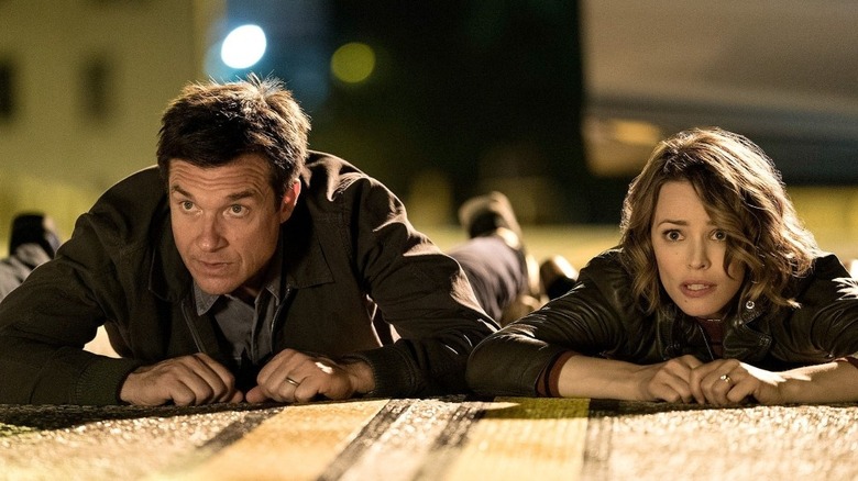 Jason Bateman and Rachel McAdams as Max and Annie, hoping they don't get shot in Game Night