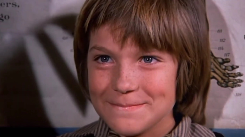 A close up of Jason Bateman as James Cooper smiling in Little House on the Prairie
