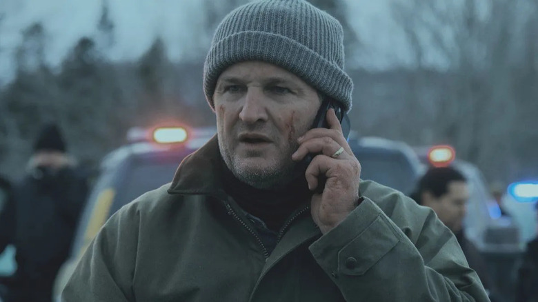 Frank Remnick holding a cell phone to his ear on The Last Frontier