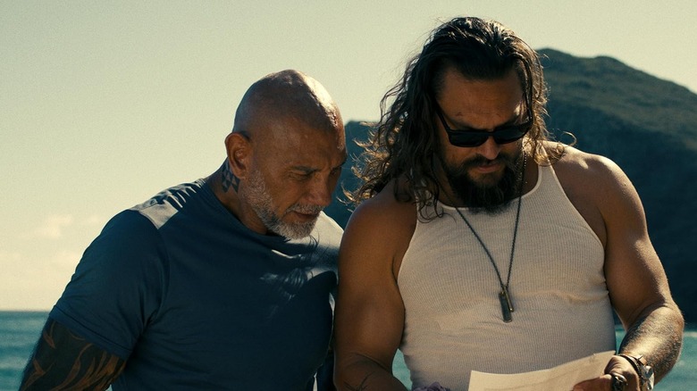 Dave Bautista's James Hale and Jason Momoa's Jonny Hale looking at a piece of paper in The Wrecking Crew