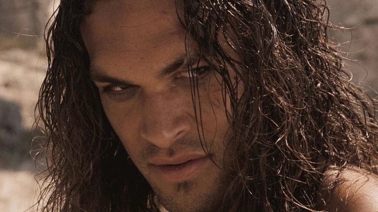 Jason Momoa as Conan staring intensely in Conan the Barbarian (2011)