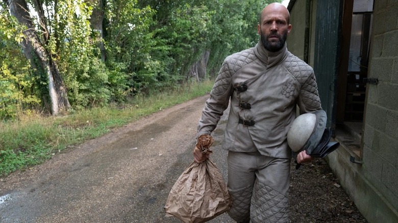 Jason Statham as Adam Clay heading to work in The Beekeeper