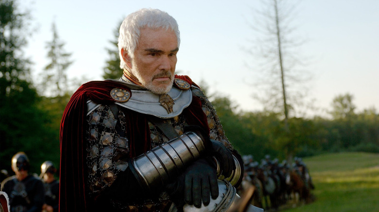 King Konreid wears armor on horseback.