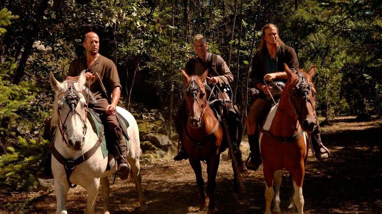 Camden, Norick and a fellow adventurer, all on horseback in the forest.