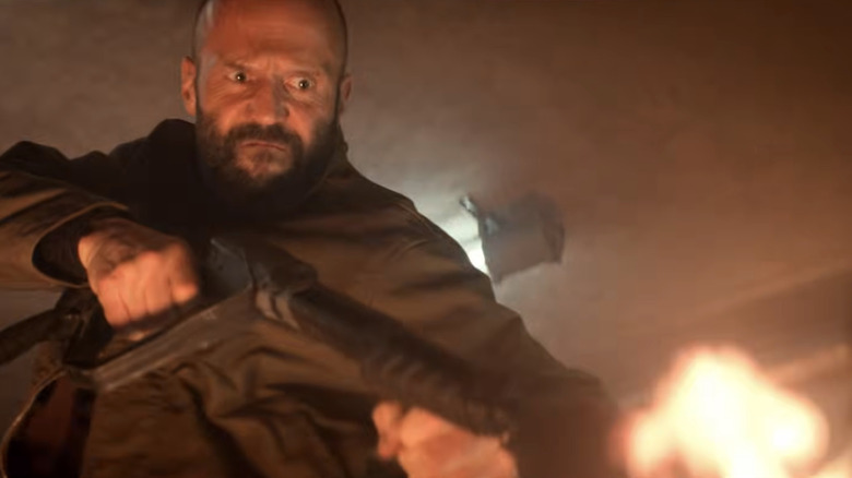 Adam Clay using a flamethrower in The Beekeeper 2