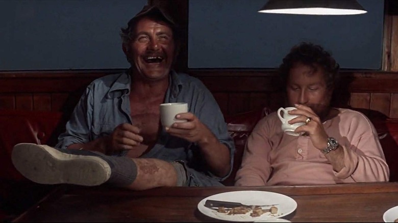 Quint and Hooper have had a little too much to drink in Jaws