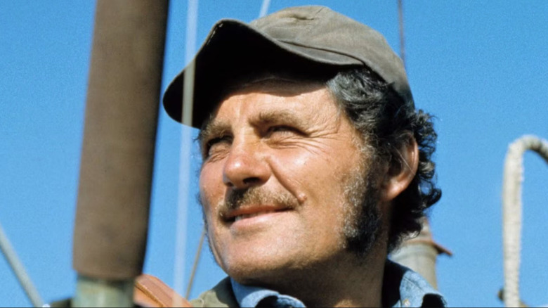 Quint squints into the sun on deck in Jaws