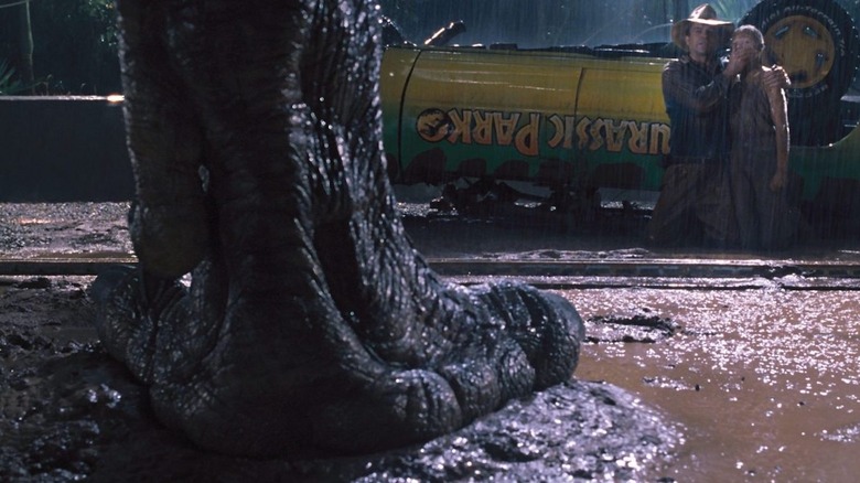 Jurassic Park T-Rex foot in front of Grant and Lex
