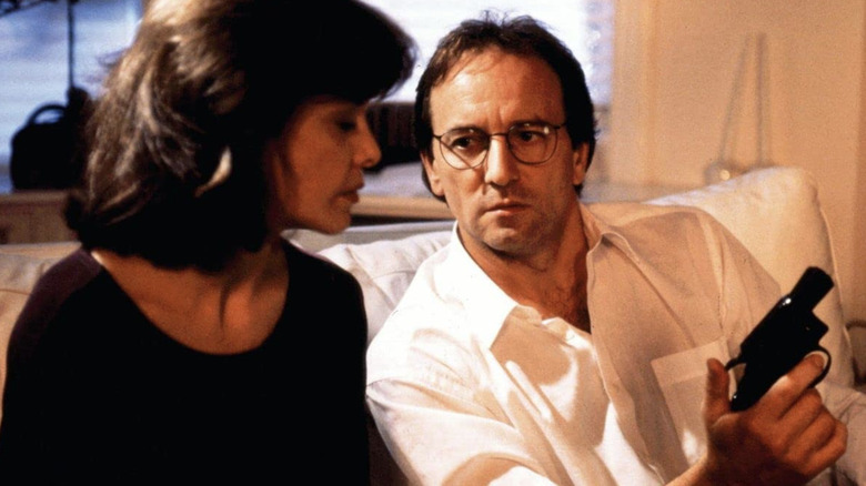 André Champagne holding a gun