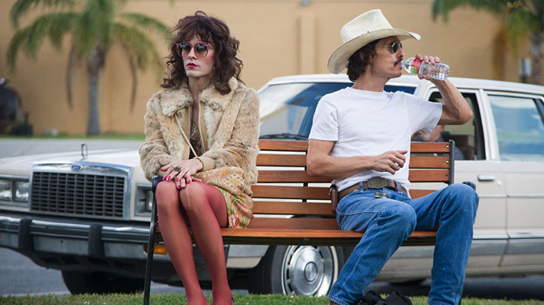 Jared Leto and Matthew McConaughey sitting together on a public bench