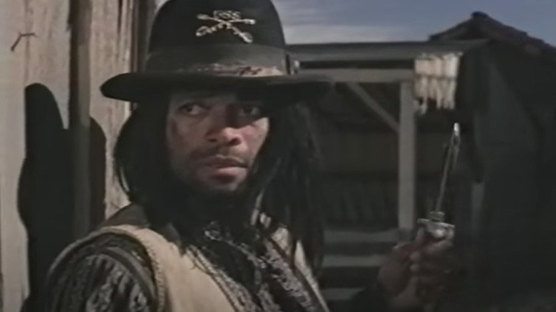 Mario Van Peebles holding a knife