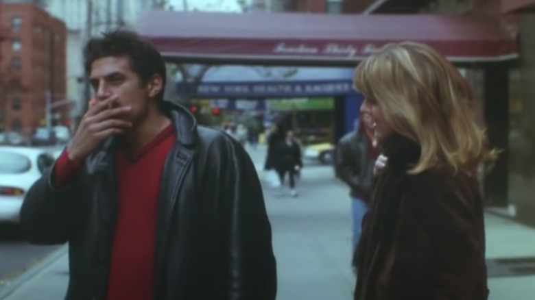 Andy Davoli and Laurel Holloman talking on the sidewalk