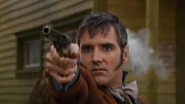 Michael Praed takes aim