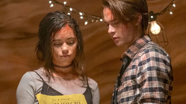 Phoebe and Cole work together to defeat the cultists in The Babysitter: Killer Queen