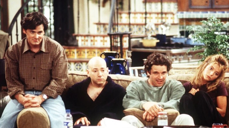 Chris Eigeman as Arthur Garment, Evan Handler as Shrug, Stephen Eckholdt as Robbie Graham and A.J. Langer as Lauren Woods watch television in It's Like, You Know...