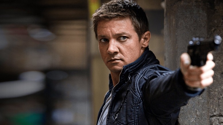 Jeremy Renner indicates a gun