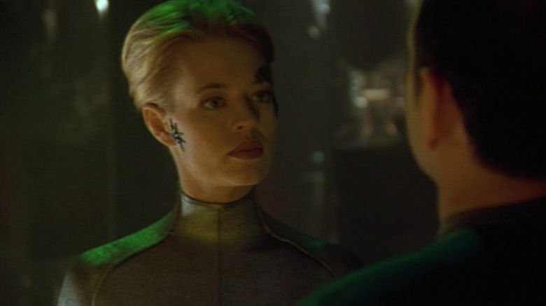 Seven of Nine looking at the Doctor on Star Trek: Voyager