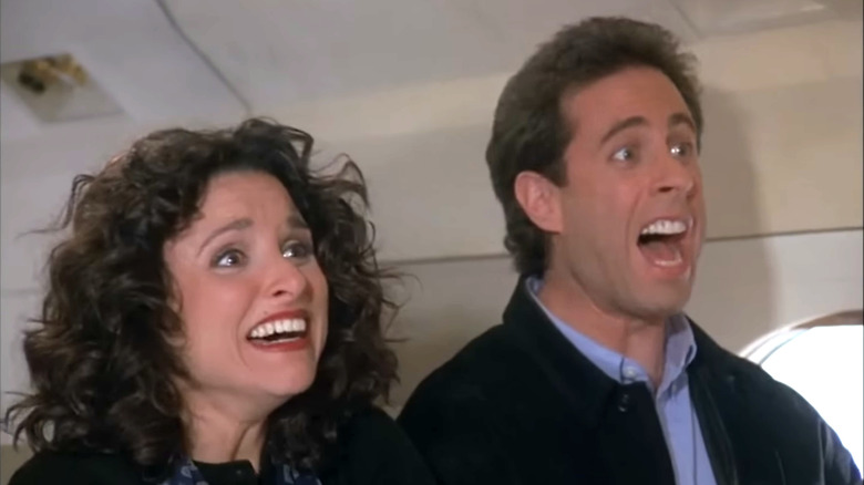Seinfeld, Elaine and Jerry celebrates that their plane will not crash, Elaine looking wrong on Jerry's couch