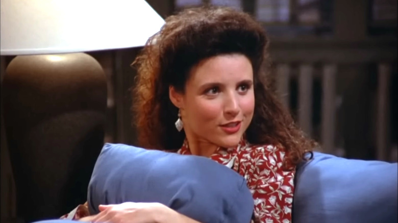 Seinfeld, Elaine sits on the couch