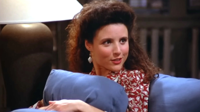 Seinfeld, Elaine sitting on a couch