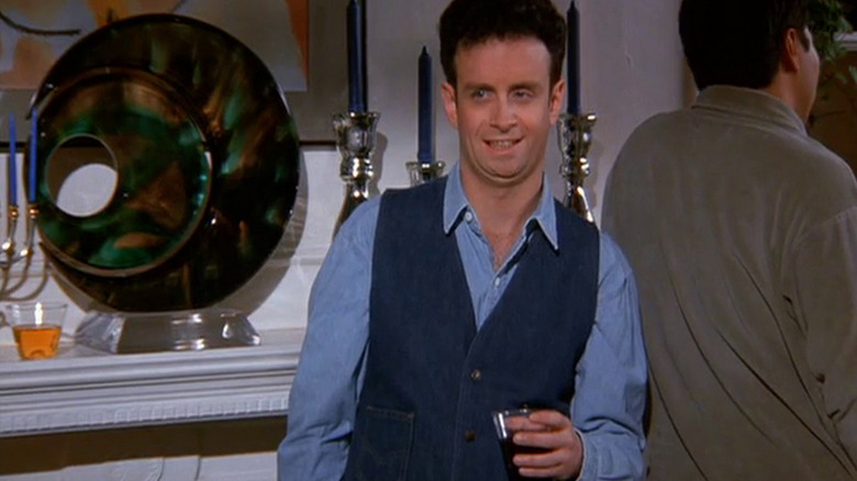 Kevin McDonald as Denim Vest/Steve holding a glass on Seinfeld