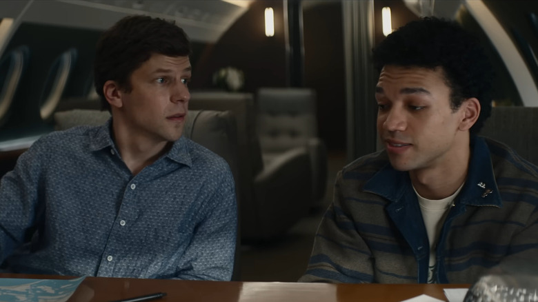 J. Daniel Atlas sitting at a table with Charlie in Now You See Me: Now You Don't
