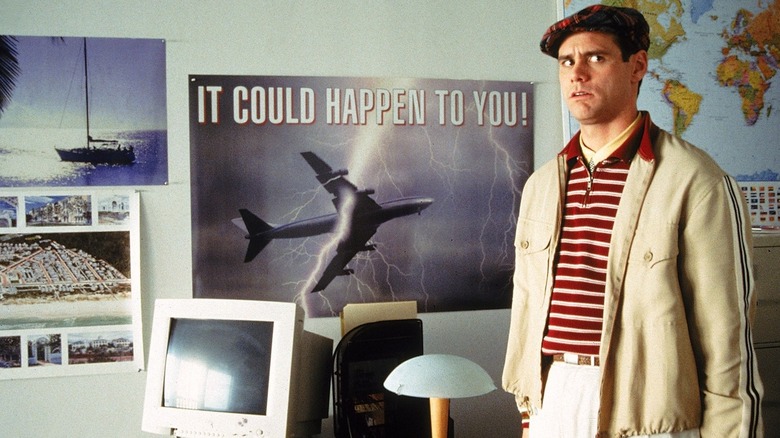 Jim Carrey next to computer The Truman Show
