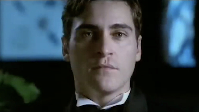 Joaquin Phoenix's John stares ahead in It's All About Love