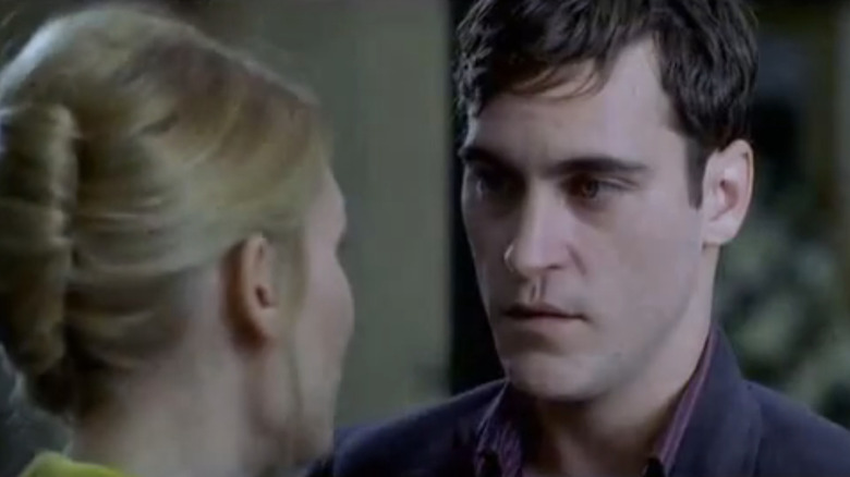 Joaquin Phoenix's John is seen in closeup as he talks to Claire Danes' Elena in It's All About Love