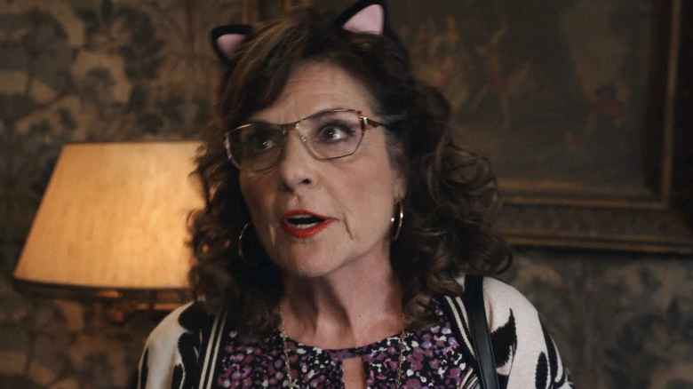 Caroline Aaron as Carol wearing cat ears in Ghosts