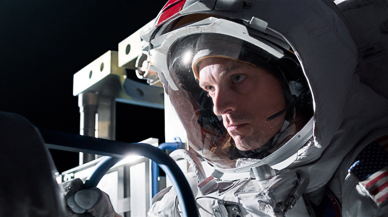 Joel Kinnaman's Edward Baldwin is seen through the visor of his helmet in For All Mankind
