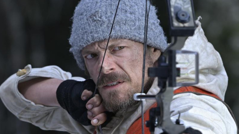 Joel Kinnaman prepares to fire an arrow as Harlan in Icefall