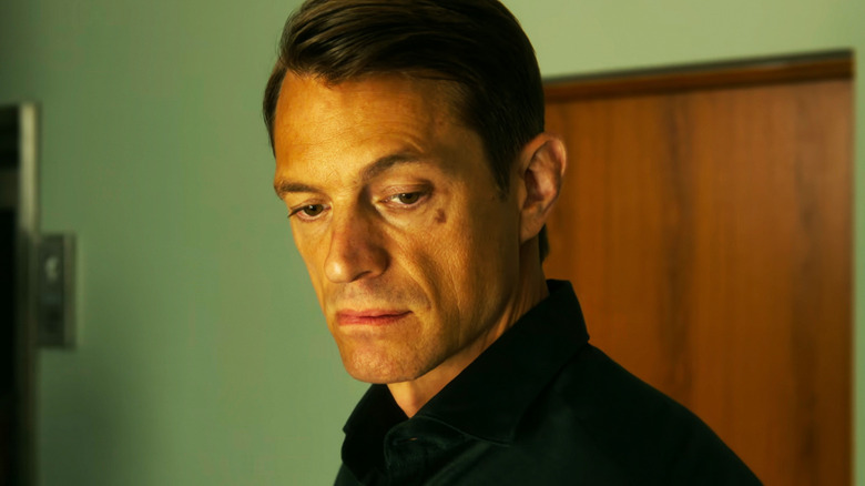 Joel Kinnaman's Tom Waaler is seen in closeup standing in an office in Jo Nesbø's Detective Hole