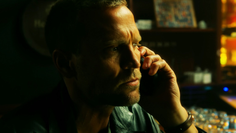 Tobias Santelmann's Harry Hole talks on the phone in Jo Nesbø's Detective Hole