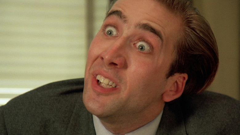 Nicolas Cage as Peter smiling malevolently in Vampire's Kiss
