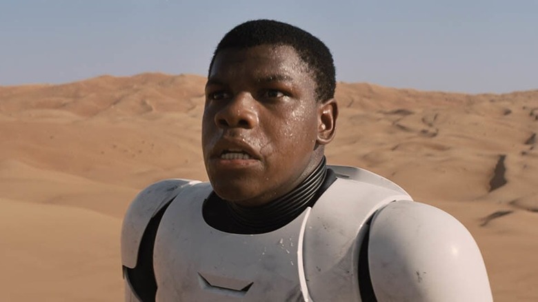 John Boyega as FN-2187 after crashing in the desert on Jakku in Star Wars: The Force Awakens