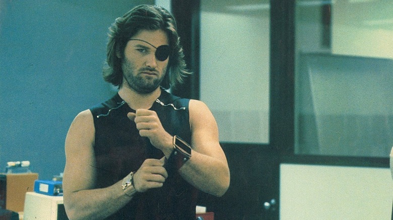 Snake Plissken strapping on a watch in Escape from New York