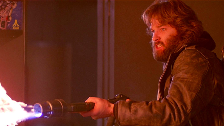 Kurt Russell uses a flamethrower in The Thing
