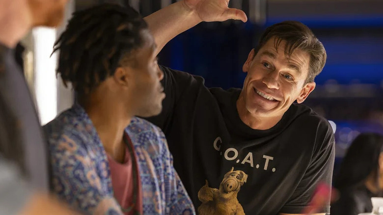 John Cena as Ron looking for a high five at the bar in Ricky Stanicky