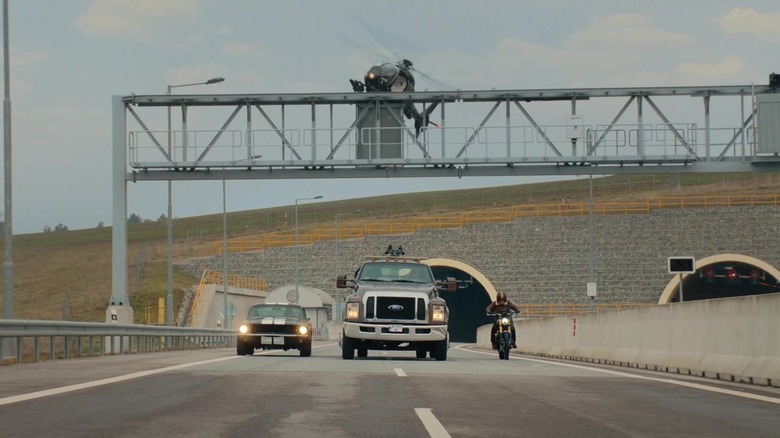 A helicopter is in hot pursuit of a muscle car, a truck and a motorcycle in Matchbox: The Movie