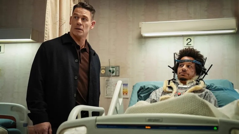 John Cena as Rudd Landy stands next to a haloed Eric André as Marcus Pinchel in Little Brother