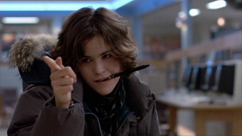 Ally Sheedy as Allison pointing her finger with a pen in her mouth in The Breakfast Club