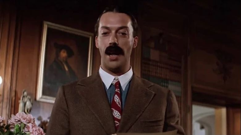 Tim Curry as Rooster in Annie