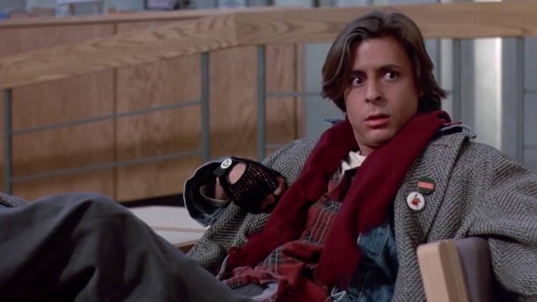 Judd Nelson as John Bender doing a 'Who, me?' gesture in The Breakfast Club