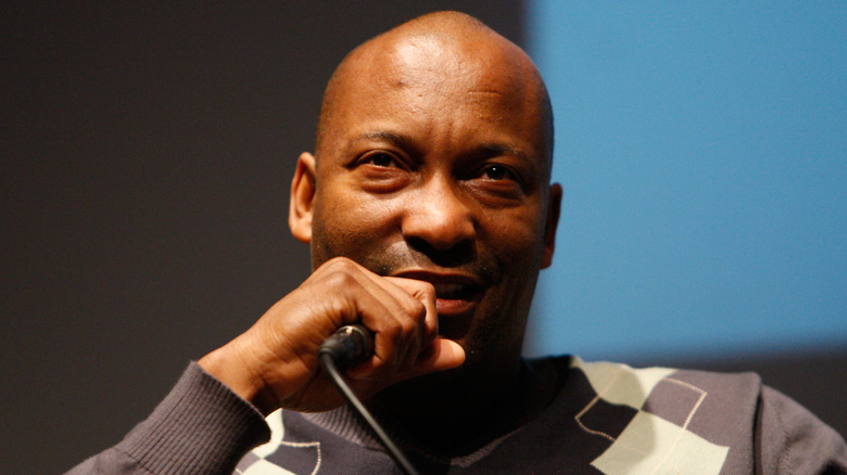 John Singleton talking into a microphone 