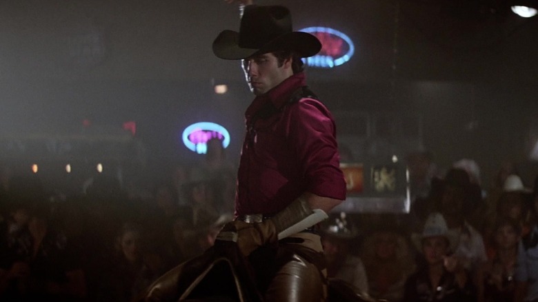 John Travolta' Buford Uan Bud Davis sits on a mechanical bull in Urban Cowboy