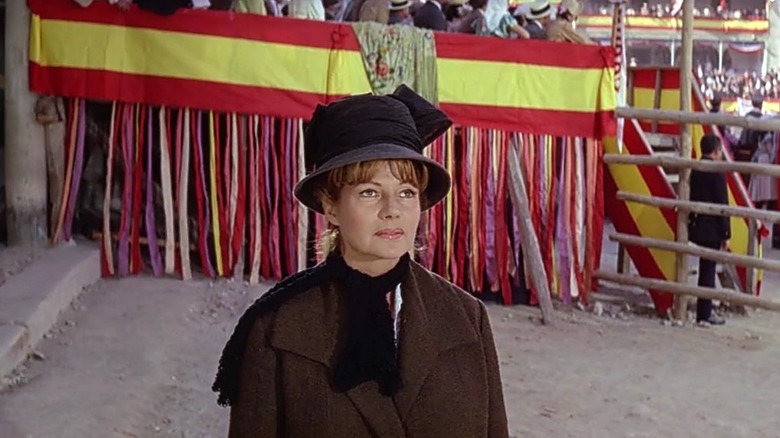 Lili standing next to the stands of a circus in Circus World